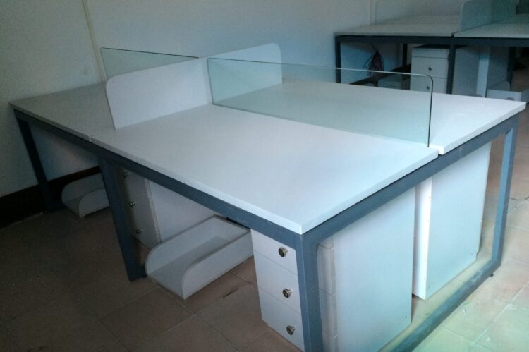 Office workstation with glass partitions, MS frame, and storage drawers.