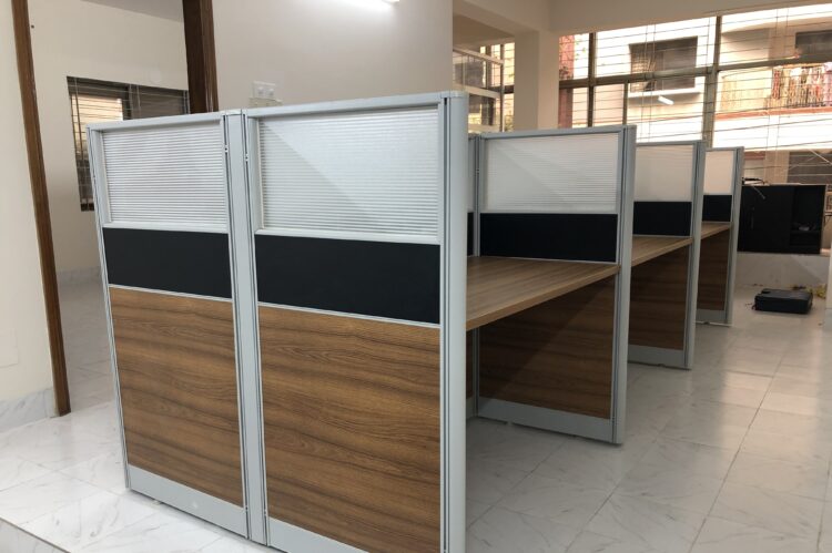 Face-to-face seating workstation with glass screens, aluminium frame, and fabric panels