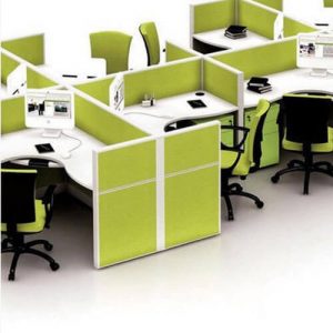 Office workstation with green fabric partitions, ergonomic chairs, and modern desk setup