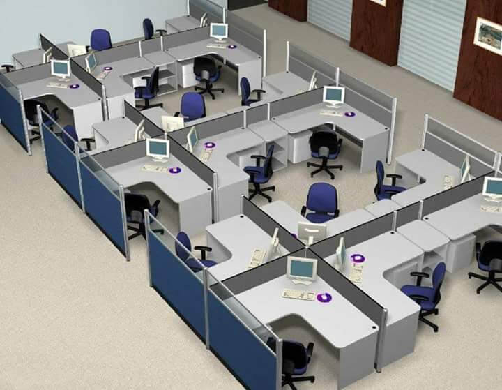 An office layout featuring cubicles with office workstations, each equipped with desks, chairs, and computer monitors, separated by grey partitions.
